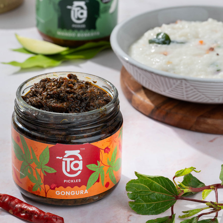 Ta Gongura Pickle jar with curd rice and fresh gongura leaves